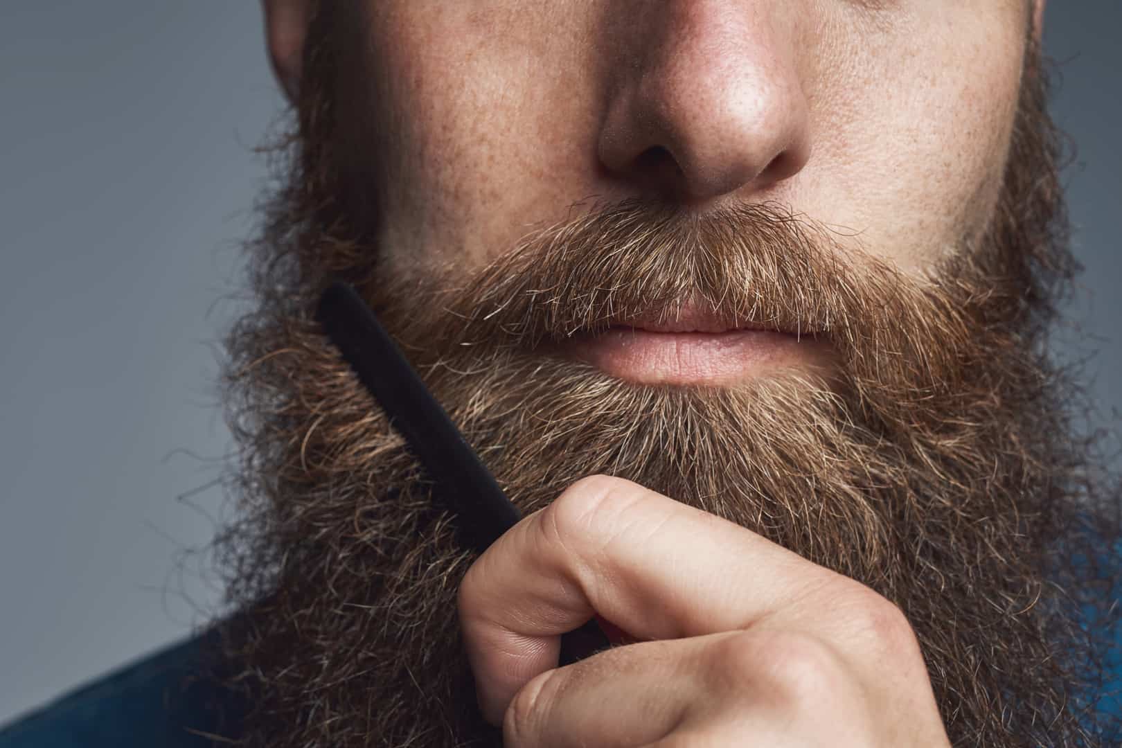Man combs beard
